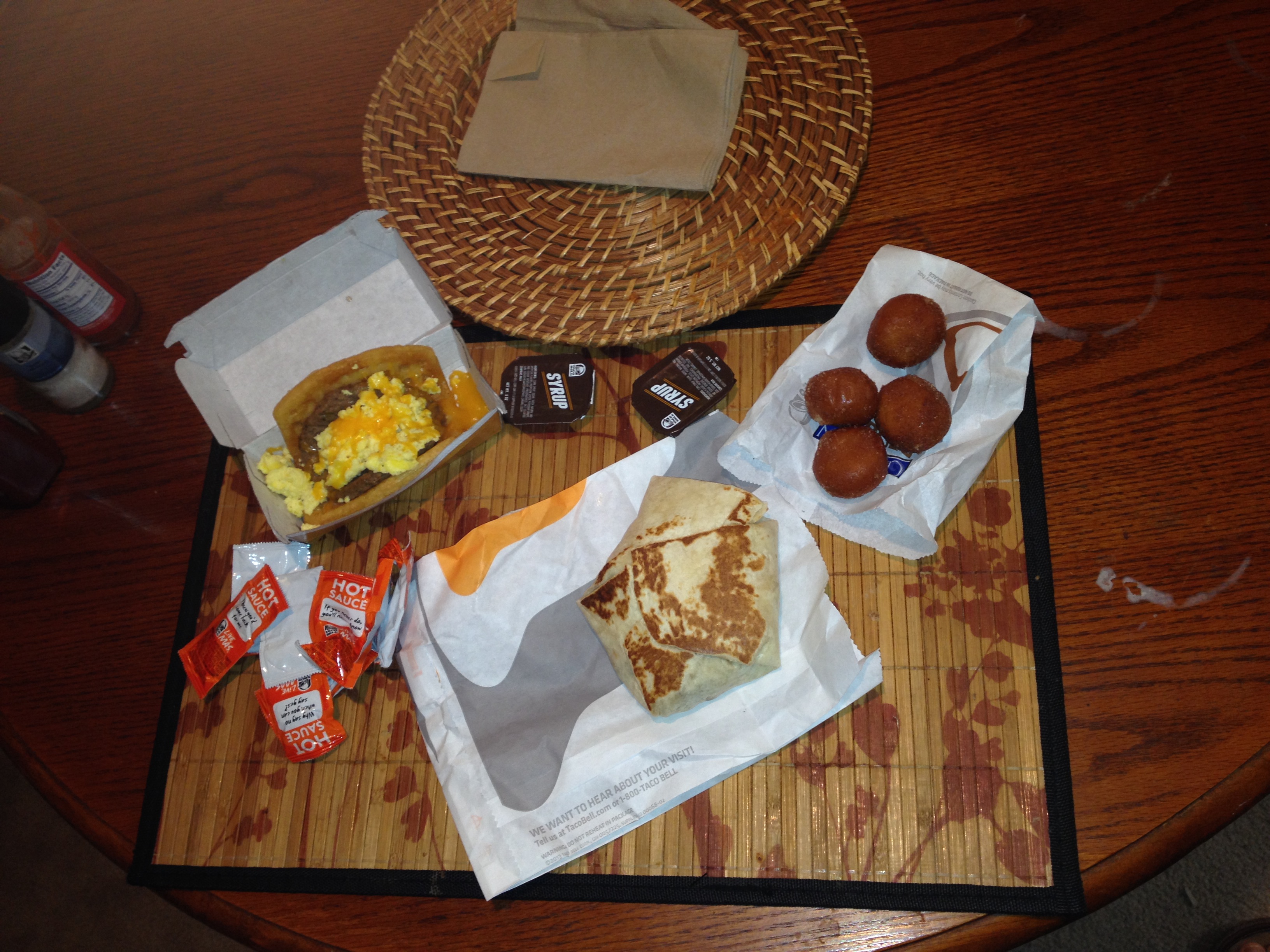 Clockwise from upper left: Waffle taco, Cinnabon Delights, A.M. Crunchwrap.